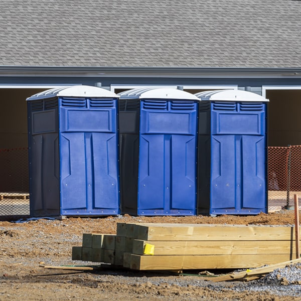 what is the cost difference between standard and deluxe portable toilet rentals in Napoleon